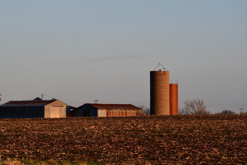 Poster - Silos by a Barn in a Farm Field