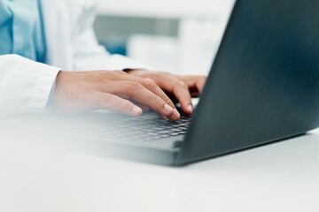 Poster - Effective research to find an effective treatment. Cropped shot of a scientist using a laptop while working in a laboratory.