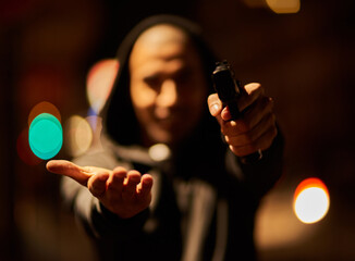 Aufkleber - Your goods or your life. Shot of a gun-wielding thief aiming his weapon.