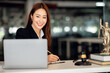 © David - Attractive young lawyer in office Business woman and lawyers discussing contract papers with brass scale on wooden desk in office. Law, legal services, advice, Justice and real estate concept.