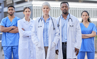 Poster - There isnt an illness we cant cure. Shot of a group of doctors standing against a city background.