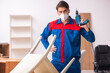 © Elnur - Young male carpenter working in the office during pandemic