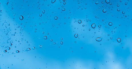 Droplet of water on car mirror, traffic jam