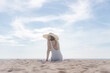 © SasinParaksa - Summer vacation on the beach, Young woman relaxing on the beach with sea view