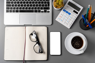 Poster - Notepad is on top of office desk table with laptop and supplies