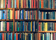 English textbooks on bookshelf Library education background