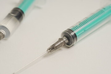 medical disposable injection syringe on a white background