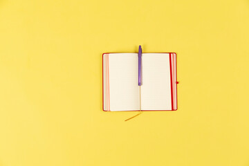 notebook on yellow background