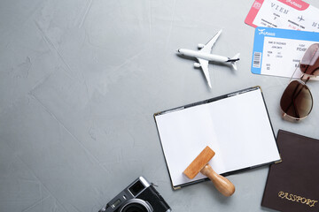 Canvas Print - Flat lay composition with passports and visa stamp on grey table. Space for text