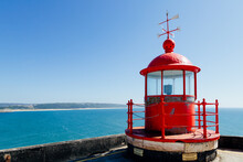 Red Lighthouse On The Sao Miguel Fort In Nazaré, Portugal,