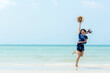 © freebird7977 - Summer Vacation. Lifestyle woman walking and jumping relax happy on beach tropical outdoor in summer day. Young people luxury and travel destination in holiday. Tourism chill leisure of trips.