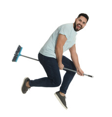 Sticker - Young man with broom jumping on white background