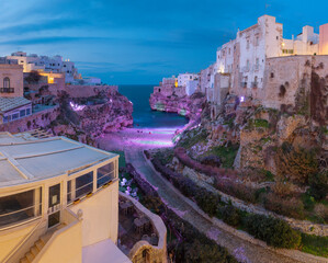 Wall Mural - Polignano a Mare - The town over the clifs at dusk.