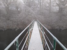 Lonely Footbridge Over The River Eden In Winter