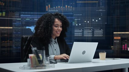 Poster - Office Manager with Animated Virtual Background: Businesswoman Sitting at a Desk Working on Laptop Computer. Black Female Working with Big Data Finance Analysis. 360 Degree Shot. Camera Moving Around.