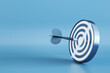 Creative bullseye target with arrow on blue background with mock up place. Targeting and marketing concept. 3D Rendering.