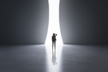 Poster - Back view of young businesswoman in concrete interior with bright opening window and mock up place on walls. Success and solution concept.