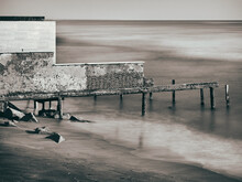 Monochrome Abandoned Old Structure On The Sea