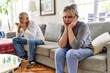 © Krakenimages.com - Senior caucasian couple in trouble sitting on the sofa at home.