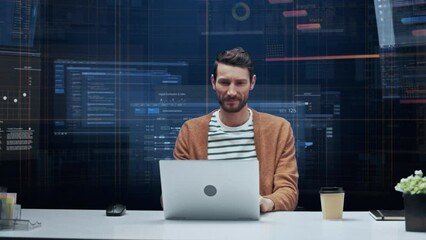 Poster - Office Manager with Animated Virtual Background: Businessman Sitting at a Desk Working on a Laptop Computer. Man Working with Big Data Finance Analysis. 360 Degree Tracking Shot. Camera Moving Around.
