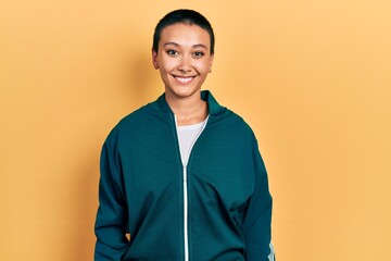 Sticker - Beautiful hispanic woman with short hair wearing sporty jacket with a happy and cool smile on face. lucky person.