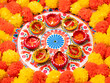 © Scopio - Diwali Rangoli with lit diyas and marigold flowers