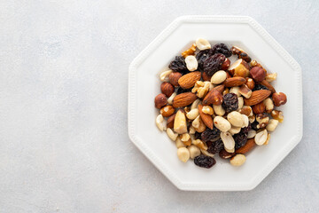 Dried fruits with nuts. Cashew, hazelnuts, peanuts, dried apricots, viburnum, raisins. Copy space