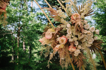 Wall Mural - Floral wedding arch from roses on sky background