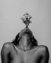 Grayscale Photo Of Woman With Flowers In Her Mouth