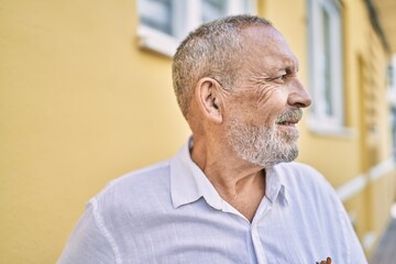 Canvas Print - Senior man smiling confident at street