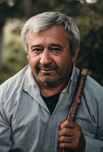Portrait Of Older Man In Gray Shirt