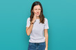 © Krakenimages.com - Young beautiful woman wearing casual white t shirt touching mouth with hand with painful expression because of toothache or dental illness on teeth. dentist