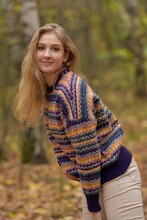 Woman In Blue And Orange Knit Sweater Smiling