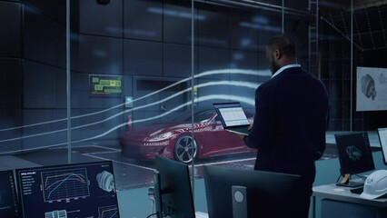 Wall Mural - Engineering Research Agency Perform Aerodynamic Testing with a Modern Eco-Friendly Electric Sports Car in a Wind Tunnel. Professional Scientist Works on a Laptop Computer and Changes Testing Options.