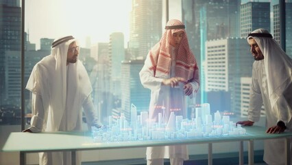 Wall Mural - Group of Arab Real Estate Business Developers in Traditional Clothes Discuss Investing Opportunities Based on Holographic Augmented Reality 3D City Model in Their Modern Office in a Skyscraper. 