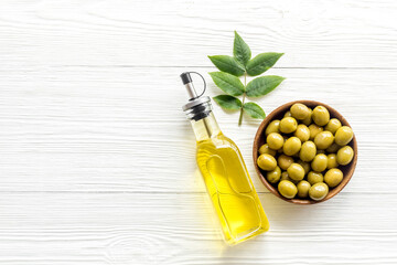 Wall Mural - Olive oil in bottle with ingredient - green olives