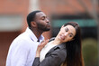 © PheelingsMedia - Man trying to kiss to a woman who is pulling him away