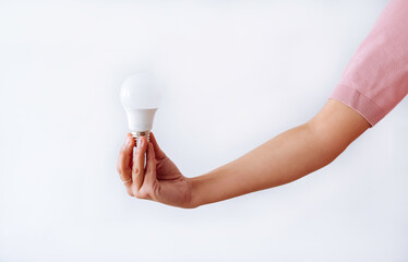 hand holding a light bulb