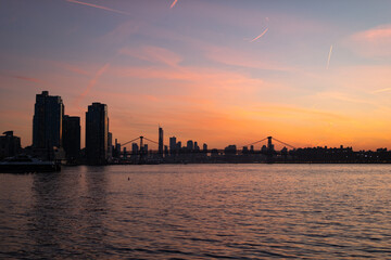 Wall Mural - Colorful Sunset along the East River in New York City with the Williamsburg Bridge