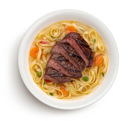 Wall Mural - Fettuccine noodles with grilled beef isolated on white, top view