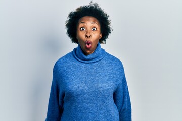 Poster - Young african american woman wearing casual clothes scared and amazed with open mouth for surprise, disbelief face