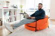 © Prostock-studio - Freelancer Guy Using Laptop Working Online Browsing Internet Sitting Indoors