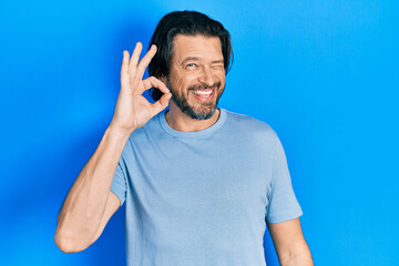 Poster - Middle age caucasian man wearing casual clothes smiling positive doing ok sign with hand and fingers. successful expression.