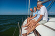 © Spotmatik - Group of retired friends relaxing together on yacht