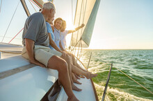 Relaxed Group Of Senior Friends Sailing Luxury Yacht