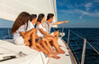 © Spotmatik - Hispanic family with young children relaxing on yacht