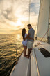 © Spotmatik - Loving young Hispanic couple on yacht at sunrise