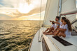 © Spotmatik - Latino family enjoying fun sailing adventures at sunrise