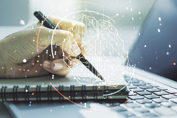 Wall Mural - double exposure of creative human brain microcircuit with hand writing in notepad on background with