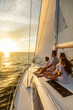 © Spotmatik - Hispanic family enjoying ocean sunset from luxury yacht